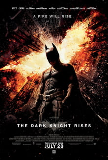 Batman standing in Gotham with a flaming bat symbol above, The Dark Knight Rises