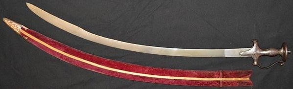 Indian tulwar sword, silver koftagri decorated hilt, red velvet covered scabbard. Scimitar