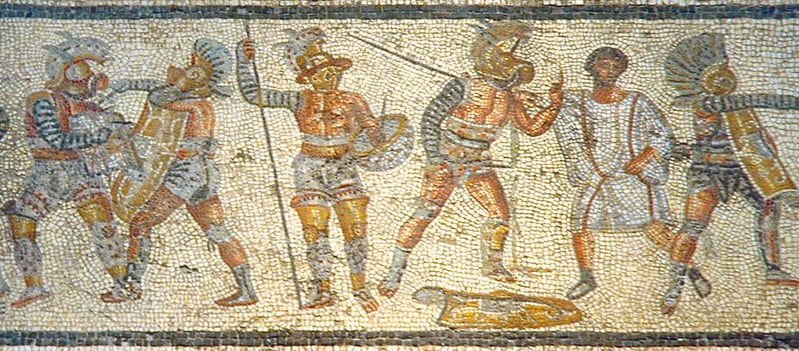 Part of the Zliten mosaic from Libya (Leptis Magna), circa 80-100 CE. It shows (left to right) a thraex fighting a murmillo, a hoplomachus standing with another murmillo (who is signaling his defeat to the referee), and one of a matched pair.