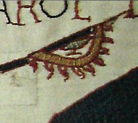 Detail from the Bayeux Tapestry, showing a Norman knight carrying what appears to be a raven banner.