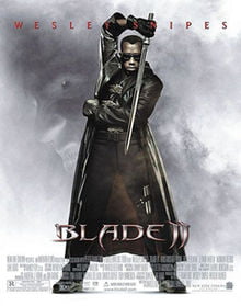 Blade standing opposite his opponent, wearing his traditional jet black special suit and sunglasses, wielding his Titanium made, acid edged sword, with a negative background image around him showing the face of an evil vampire. Near the bottom are the film's name, credits and billing details. Wesley Snipes' name is written on the bottom. Blade II