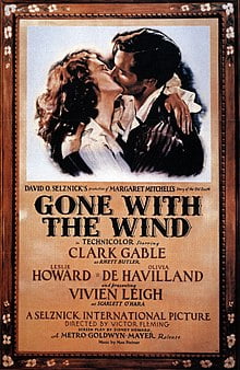 A film poster showing a man and a woman in a passionate embrace. Gone with the Wind