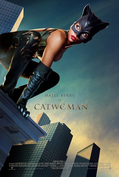 Movie poster that reads: "Halle Berry is Catwoman". In the foreground, Berry wears a leather suit and crouches on the edge of a tall building. Catwoman