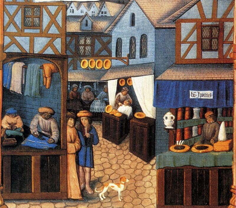 Medieval market and craftsmen working from street-facing shops and stalls