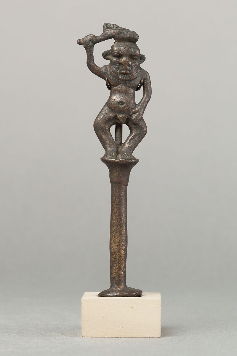 Ancient Egyptian Bes figure brandishing a protective knife